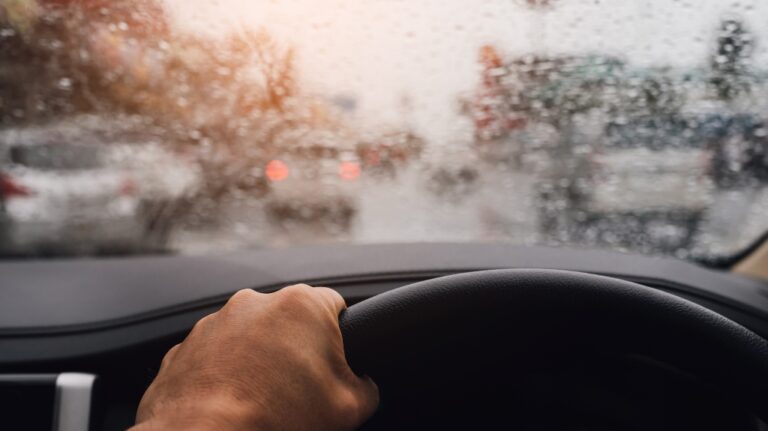 driver in traffic on a rainy day